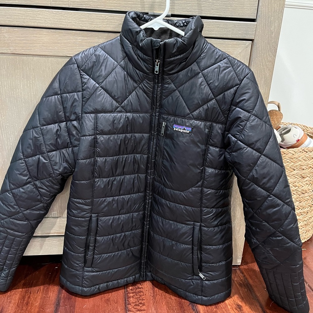 Patagonia women’s black puffer jacket size medium.